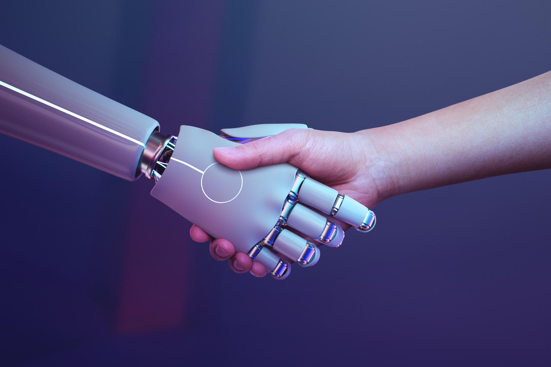 En menneskehånd mødes med en robot